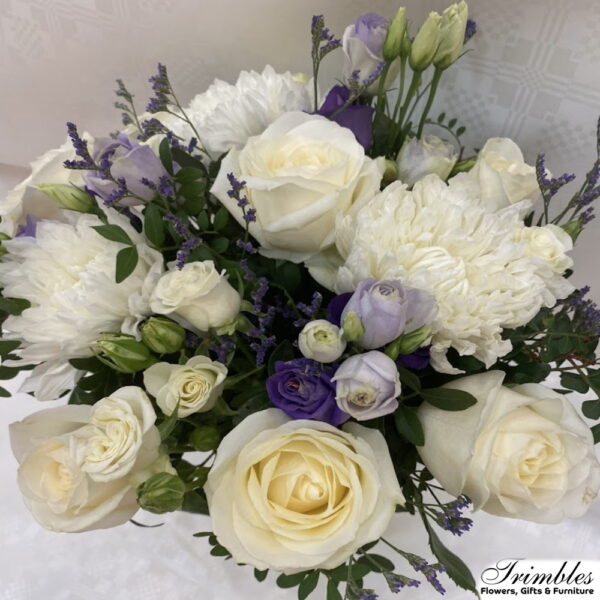 Chic white and purple bouquet with lush chrysanthemums and elegant lisianthus.